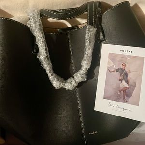 As seen in Emily in Paris, the Polene Cyme tote in Black textured leather.